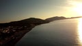 Aerial view sunrise over kiotari beach in Rhodes, greece. Smooth cinematic footage with buildings on the beach front