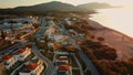 Aerial view sunrise over kiotari beach in Rhodes, greece. Smooth cinematic footage with buildings included