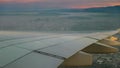 Aerial view of sunrise and plane wing over los angeles Royalty Free Stock Photo