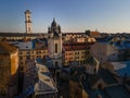 aerial view of sunset above old european city. church bell tower Royalty Free Stock Photo