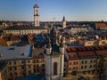 aerial view of sunset above old european city. church bell tower Royalty Free Stock Photo