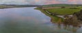 An aerial view at sunset across Eyebrook reservoir, Leicestershire