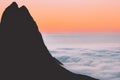 Aerial view sunset landscape mountain silhouette above clouds in Norway Royalty Free Stock Photo