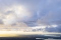Aerial view sunset over the forest and lake. View from drone. Aerial top view cloudscape. Texture of clouds. View from above. Sunr Royalty Free Stock Photo