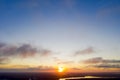 Aerial view sunset over the forest and lake. Top view. View from drone. Aerial top view cloudscape. Texture of clouds. View from a Royalty Free Stock Photo