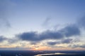 Aerial view sunset over the forest and lake. Top view. View from drone. Aerial top view cloudscape. Texture of clouds. View from a Royalty Free Stock Photo