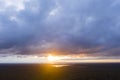 Aerial view sunset over the forest and lake. Top view. View from drone. Aerial top view cloudscape. Texture of clouds. View from a Royalty Free Stock Photo