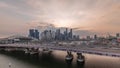 Aerial view of sunset over Helix Bridge and Bayfront Avenue with traffic timelapse at Marina Bay, Singapore Royalty Free Stock Photo