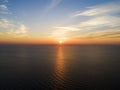 Aerial view of a Sunset sky background. Aerial Dramatic gold sunset sky with evening sky clouds over the sea. Stunning sky clouds Royalty Free Stock Photo