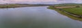 An aerial view at sunset towards the western end of Eyebrook reservoir, Leicestershire