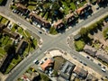 Aerial view of surburban intersection in town of Ipswich, UK. Cars passing by.