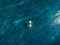 Aerial view of surfer in blue clear ocean. Top view Royalty Free Stock Photo