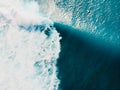 Aerial view of surfer on ideal wave in tropical blue ocean. Top view Royalty Free Stock Photo