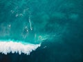 Aerial view with surfers and barrel wave in tropical blue ocean. Top view Royalty Free Stock Photo