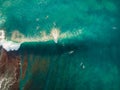 Aerial view with surfers and big wave in tropical blue ocean. Top view Royalty Free Stock Photo