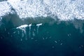 Aerial view of surfers riding the waves in Newport Beach, California Royalty Free Stock Photo