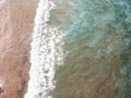 Aerial view of surfers in the waves of the  Atlantic ocean. Sandy beach. Panorama background shot on a drone. Selectivity focus Royalty Free Stock Photo