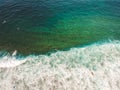 Aerial view of surfers in the waves of the Atlantic  ocean. Sandy beach. Panorama background shot on a drone. Selectivity focus Royalty Free Stock Photo