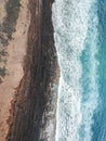 Aerial view of surfers in the waves of the Atlantic  ocean. Sandy beach. Panorama background shot on a drone. Selectivity focus Royalty Free Stock Photo