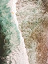 Aerial view of surfers in the waves of the  Atlantic ocean. Sandy beach. Panorama background shot on a drone. Selectivity focus Royalty Free Stock Photo