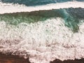 Aerial view of surfers in the waves of the Atlantic  ocean. Sandy beach. Panorama background shot on a drone. Selectivity focus Royalty Free Stock Photo