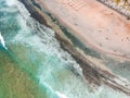 Aerial view of surfers in the waves of the  Atlantic ocean. Sandy beach. Panorama background shot on a drone. Selectivity focus Royalty Free Stock Photo