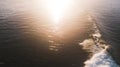 Aerial View of Surfers and Waves at Beach at Sunrise Royalty Free Stock Photo