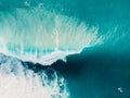 Aerial view of surfing at barrel waves. Blue wave in ocean and surfers Royalty Free Stock Photo