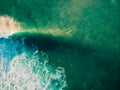 Aerial view of surfing at big waves. Surfers and ocean wave at sunset light Royalty Free Stock Photo