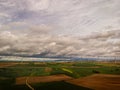Aerial View Of Sustainable Wind Turbines At The Farmfield In Valdorros In Castile and Leon, Burgos, Spain. wide shot