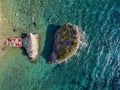 Aerial view of Sveti Nikola, Budva island, Montenegro. Jagged coasts with sheer cliffs overlooking the transparent sea