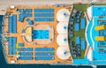 Aerial view of swimming pool, sunbeds, umbrellas on cruise ship Royalty Free Stock Photo