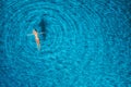 Aerial view of swimming woman in mediterranean sea at sunset Royalty Free Stock Photo