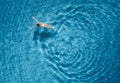 Aerial view of swimming woman in mediterranean sea at sunset Royalty Free Stock Photo