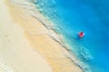 Aerial view of a swimming woman in the sea at sunset Royalty Free Stock Photo