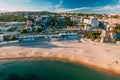 Aerial view of Tamariz Beach with Casino Estoril in the end of the garden and Hotel Palacio on Royalty Free Stock Photo