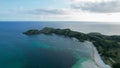 Aerial view of Tanjung Aan, Tropical island with sandy beach and turquoise ocean with waves. Lombok. Indonesia, Mach 22, 2022 Royalty Free Stock Photo