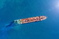 Aerial view tanker ship with liquid bulk cargo is sailing in blue water.