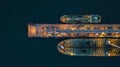 Aerial view tanker ship vessel unloading at port at night, Global business logistic import export oil and gas petrochemical with