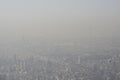 Aerial view of Tehran city from mountains side, air-polluted sky