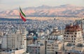 Aerial view of Tehran Skyline at Sunset with Large Iran Flag Waving in the Wind Royalty Free Stock Photo