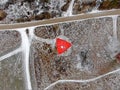 Aerial view telecommunication towers of mobile communication on the background of green field is covered with white snow. Royalty Free Stock Photo