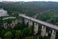 Aerial view of th ebeautiful bridge going over the green valley.