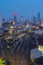 Aerial view of Thai local old classic trains or tram on railway in Hua Lamphong terminal station with skyscraper buildings at Royalty Free Stock Photo