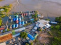 Aerial view of Thai traditional Asian fishing village near sea beach. Floating houses at sunset background in rural area, Phuket Royalty Free Stock Photo