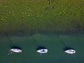 Three sailing boats mooring line beautiful pattern aerial view Royalty Free Stock Photo