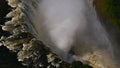 Aerial view in the throat of Victoria Falls with ground visible through the spray at the end of rainy season from helicopter. Royalty Free Stock Photo