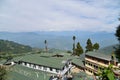 Aerial view of the Tibetan Refugee Self Help Centre in Darjeeling, West Bengal, India, with the Kanchenjunga Range in the distance