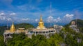 Aerial view Tiger Cave Temple, Buddha on the top Mountain with blue sky of Wat Tham Seua, Krabi,Thailand Royalty Free Stock Photo