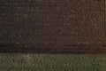 Aerial view of tilled field in sunset, top view